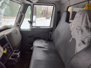 Inside view of a truck cabin in winter.